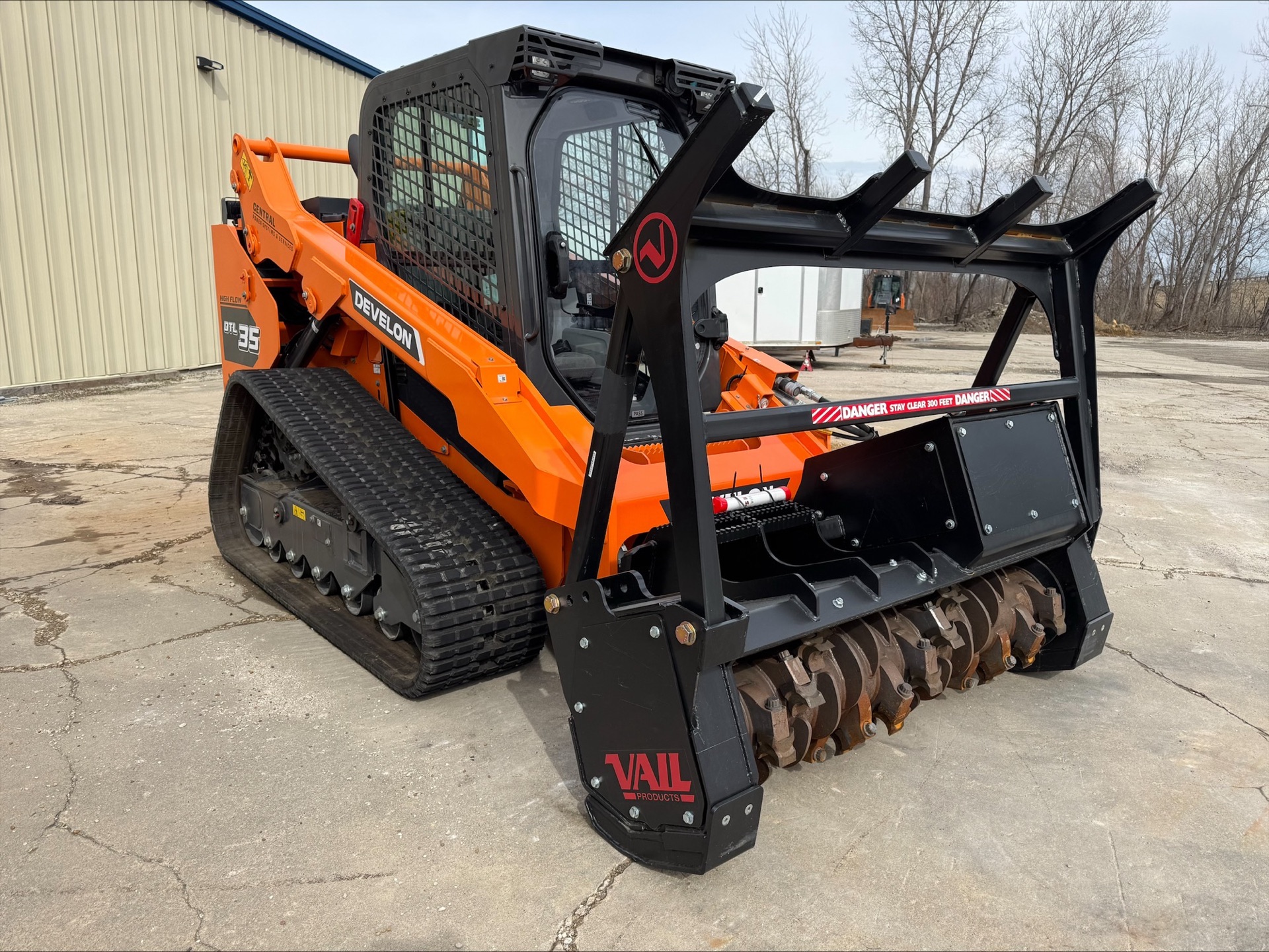 Stumpt LLC Develon DT135 skid-steer with VAIL forestry mulcher attachment