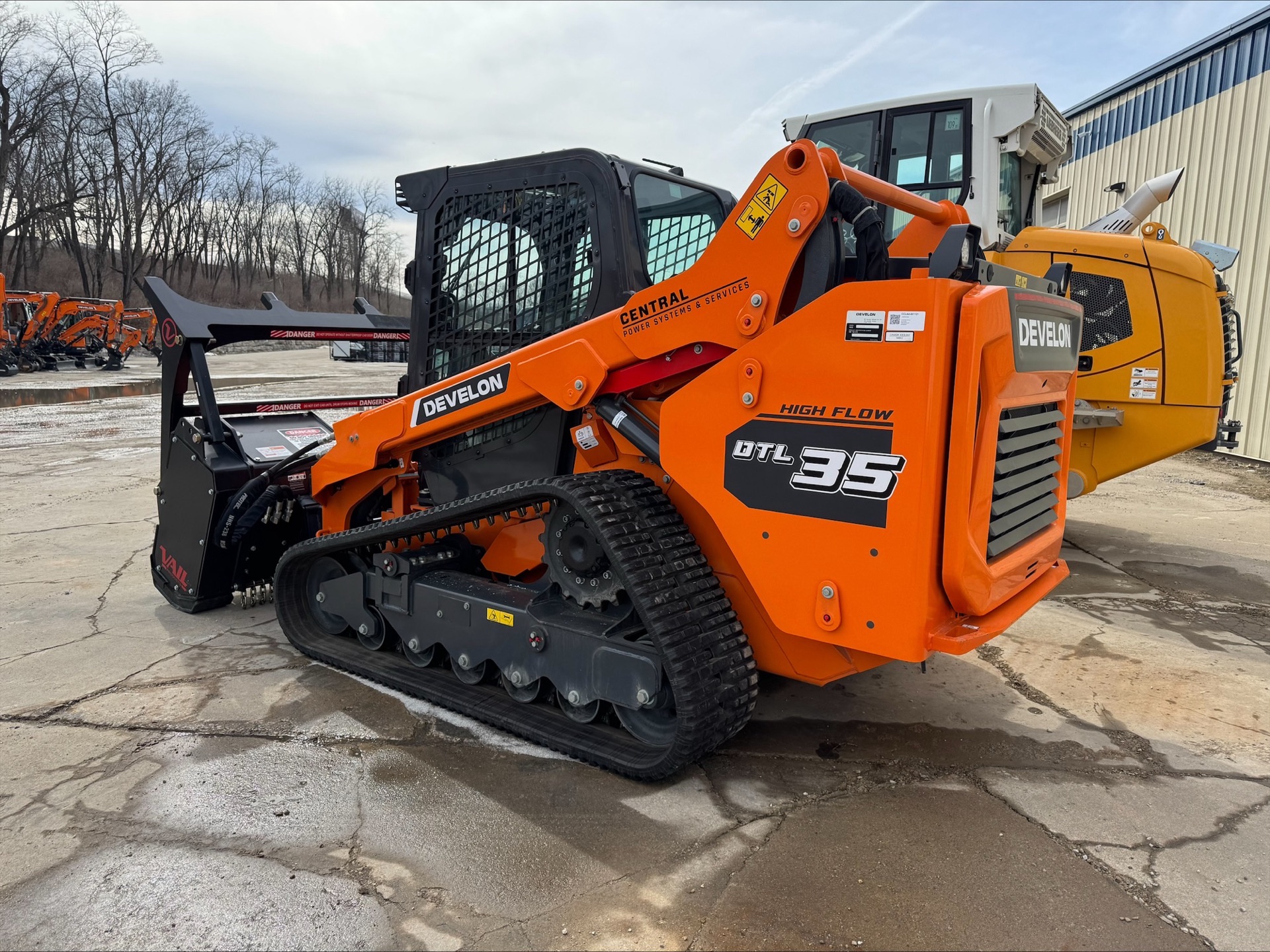 Stumpt LLC Develon DT135 compact track loader with VAIL forestry mulcher